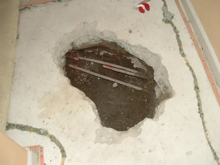 Concrete slab opened to expose copper water lines in an Escondido home