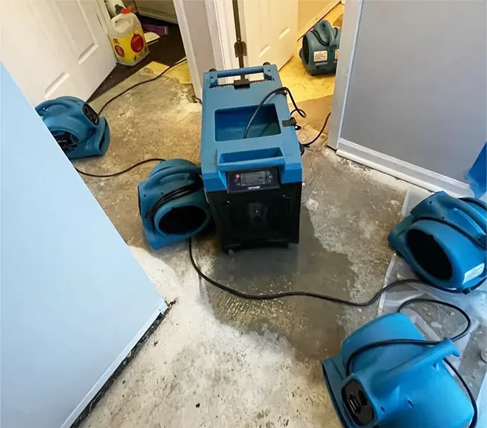 LGR dehumidifier and air movers drying a stripped subfloor in Escondido